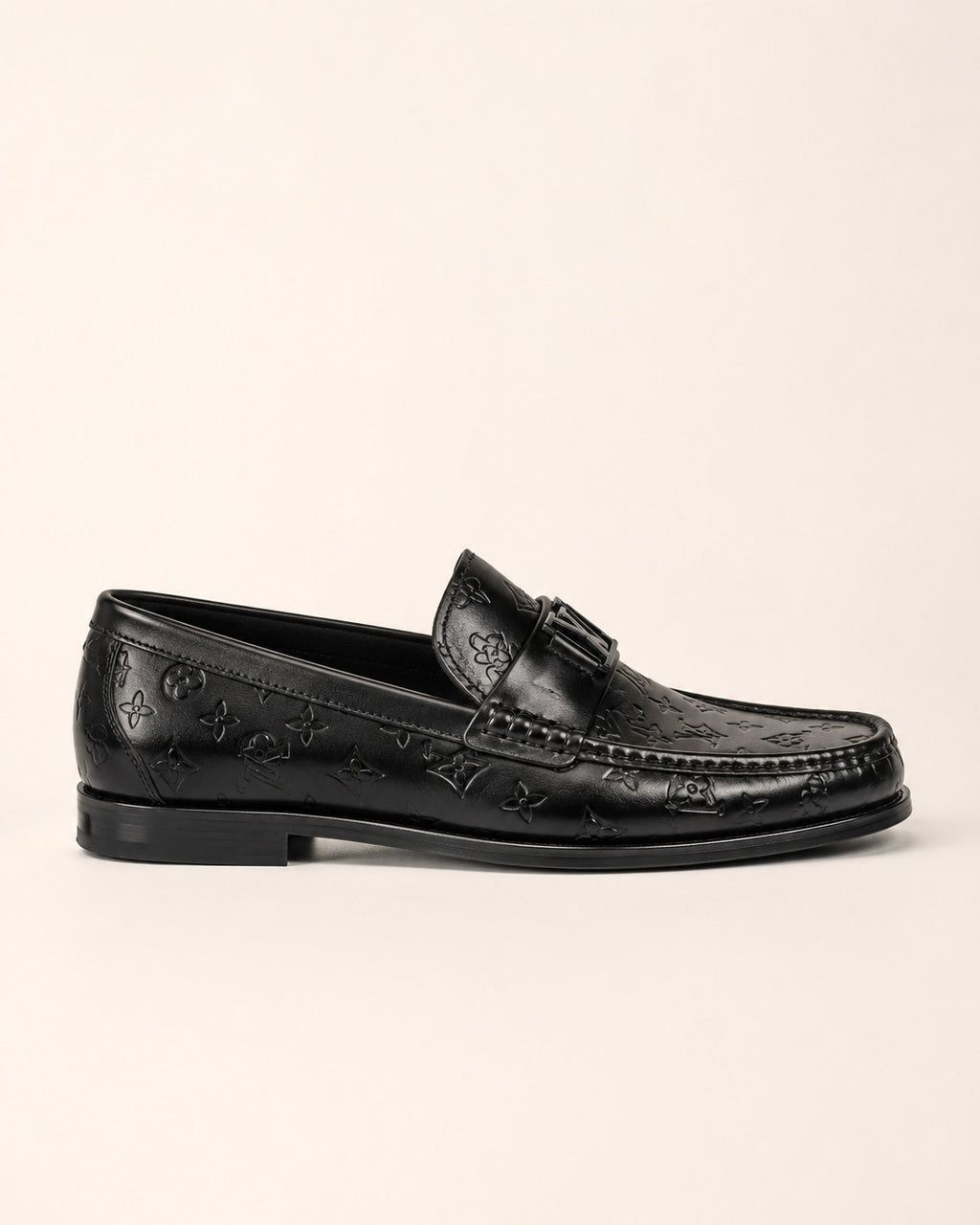 A classic Louis Vuitton Monogram Leather Penny Loafer
