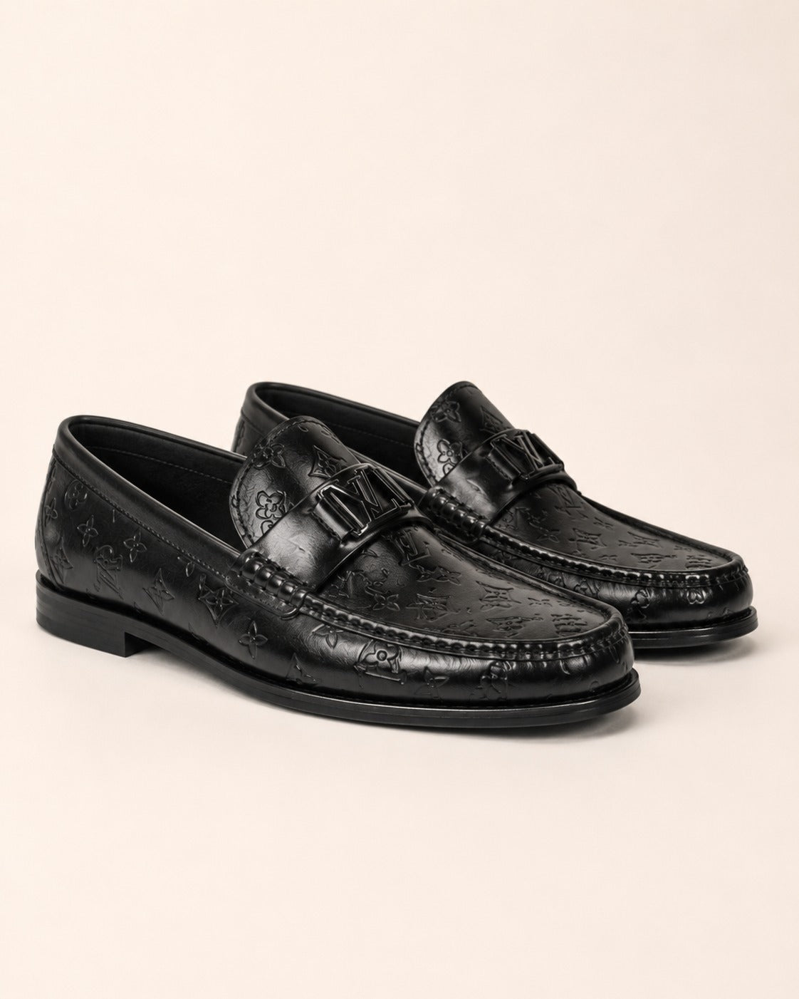A classic Louis Vuitton Monogram Leather Penny Loafer
