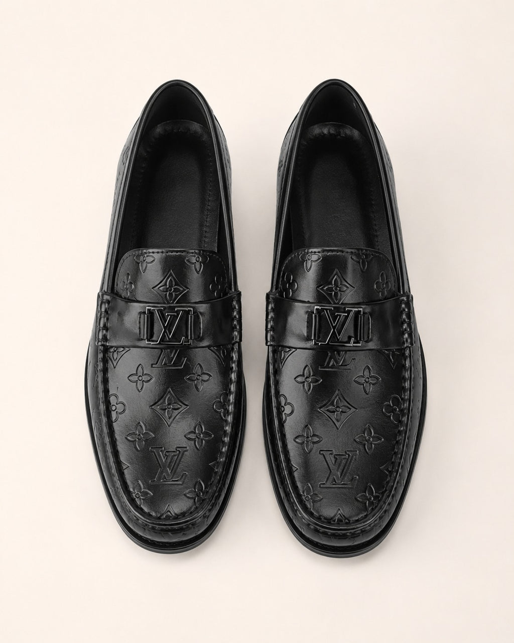A classic Louis Vuitton Monogram Leather Penny Loafer