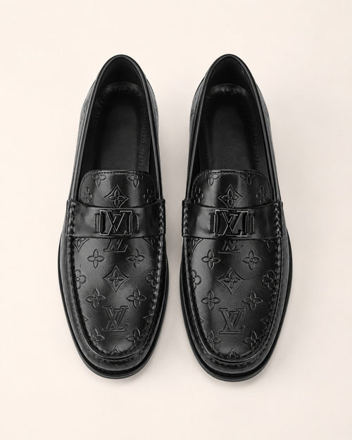 A classic Louis Vuitton Monogram Leather Penny Loafer