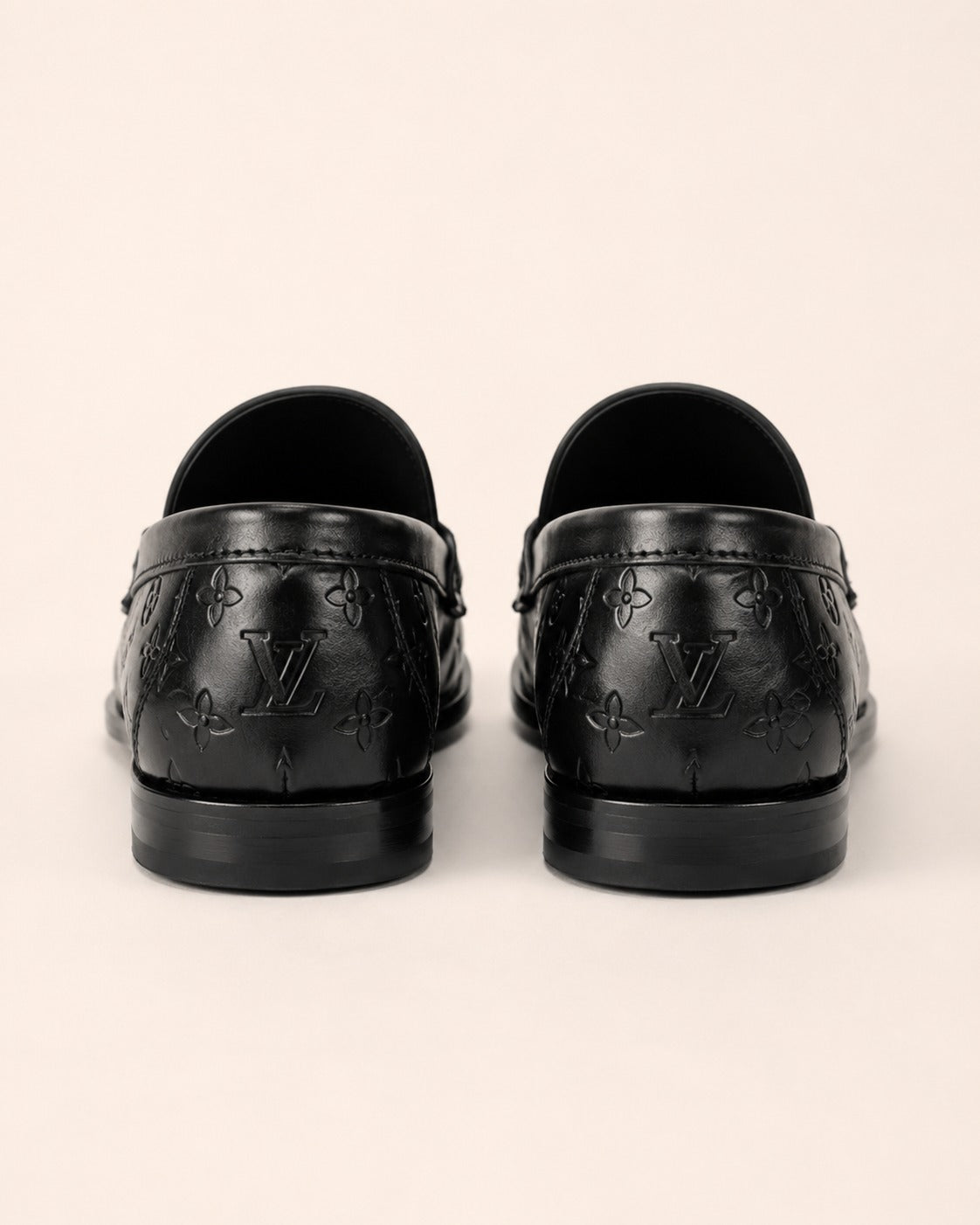 A classic Louis Vuitton Monogram Leather Penny Loafer