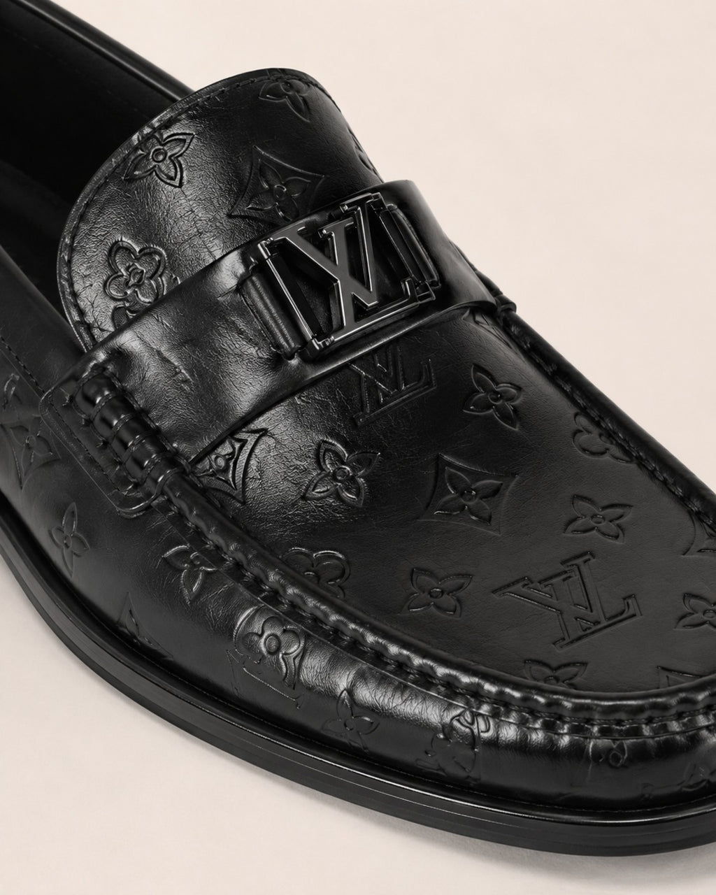 A classic Louis Vuitton Monogram Leather Penny Loafer