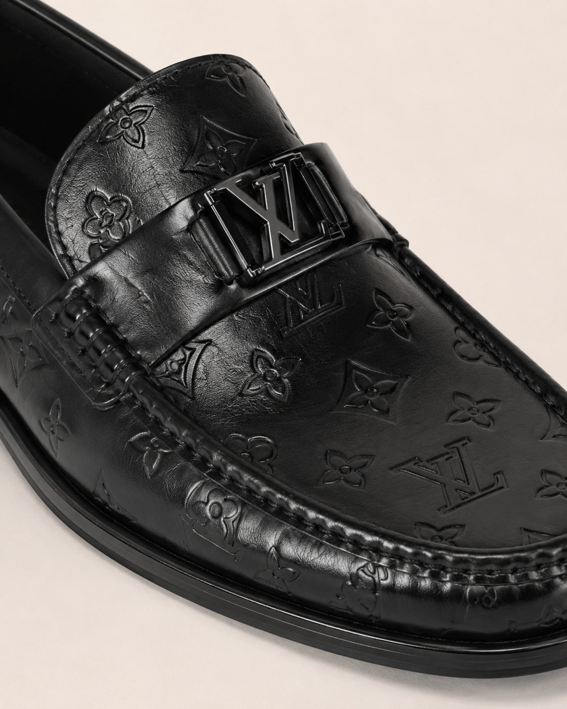 A classic Louis Vuitton Monogram Leather Penny Loafer